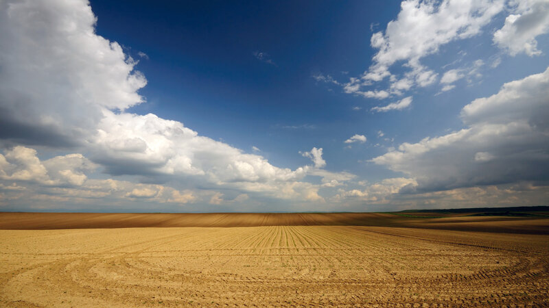 Plowed Field under Clouds — Blue, Dramatic, Afternoon, Photograph