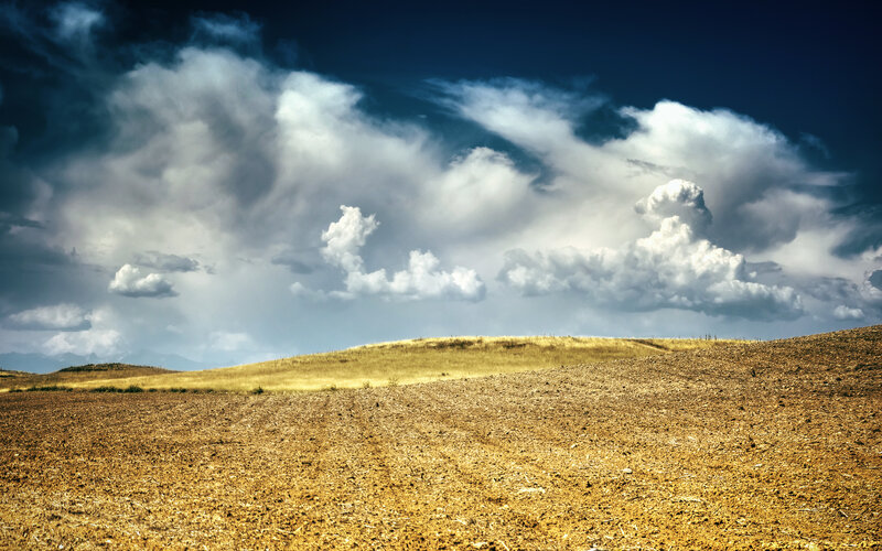 Plowed Field under Stormy Sky — Brown, Dramatic