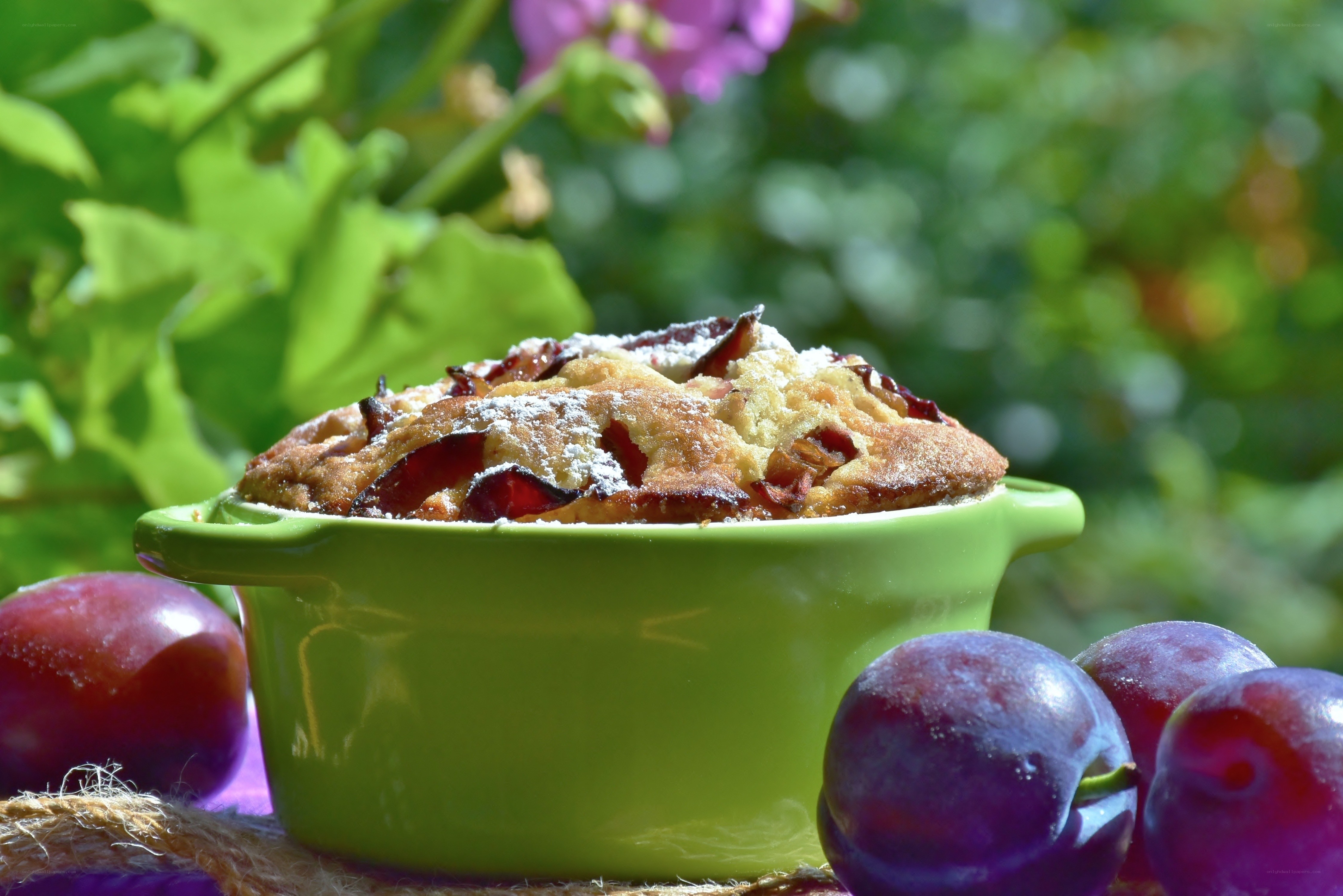 Plum cake in a green dish
