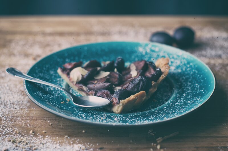 plum tart on a blue plate