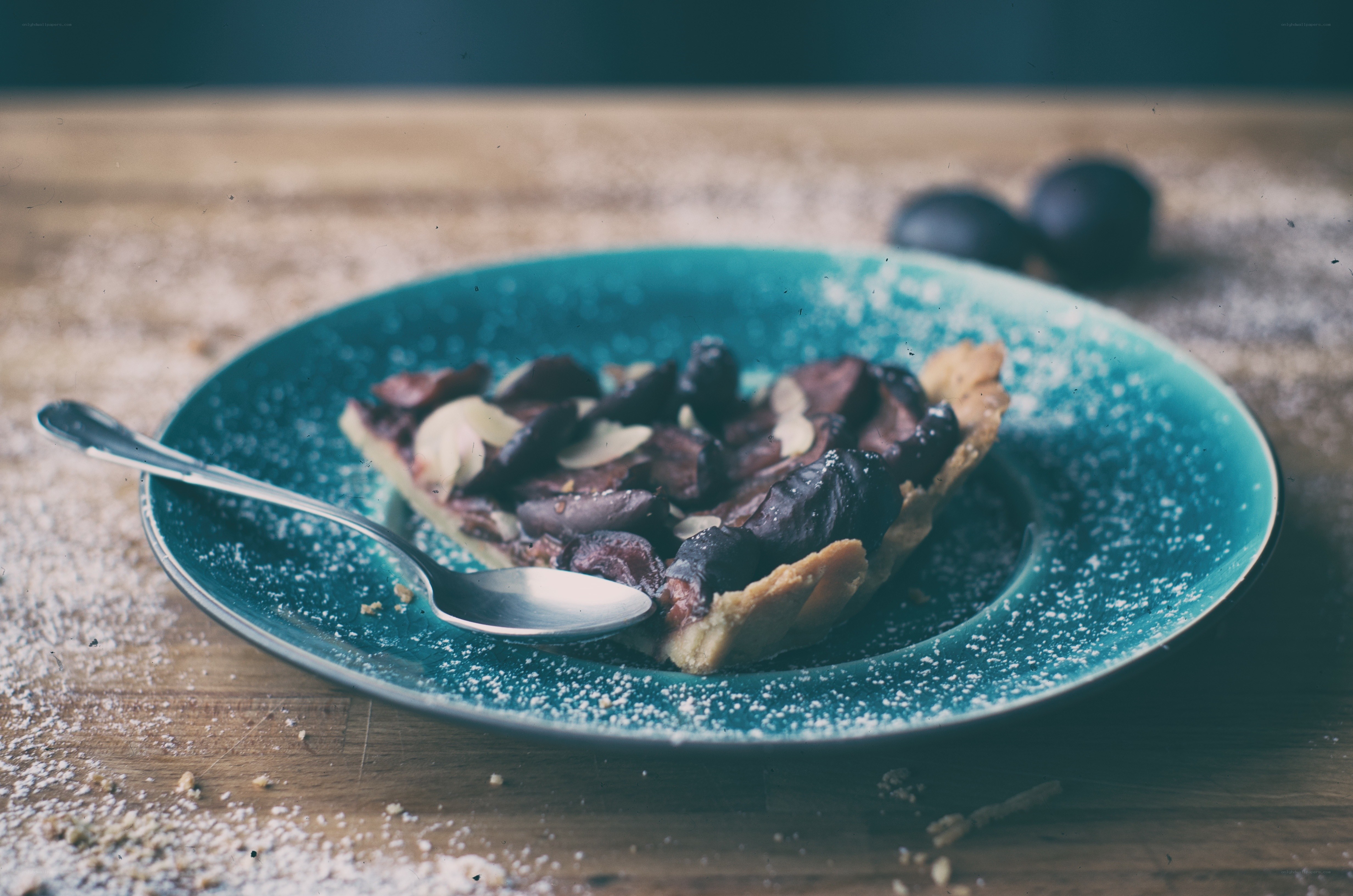 plum tart on a blue plate