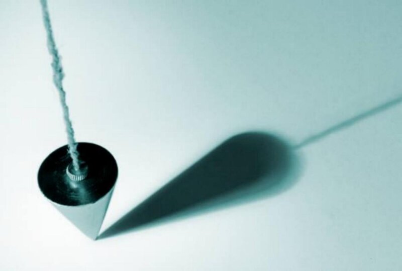 plumb bob on white surface