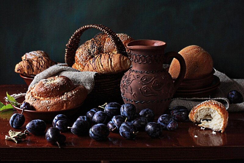 Plums and Bread on Table