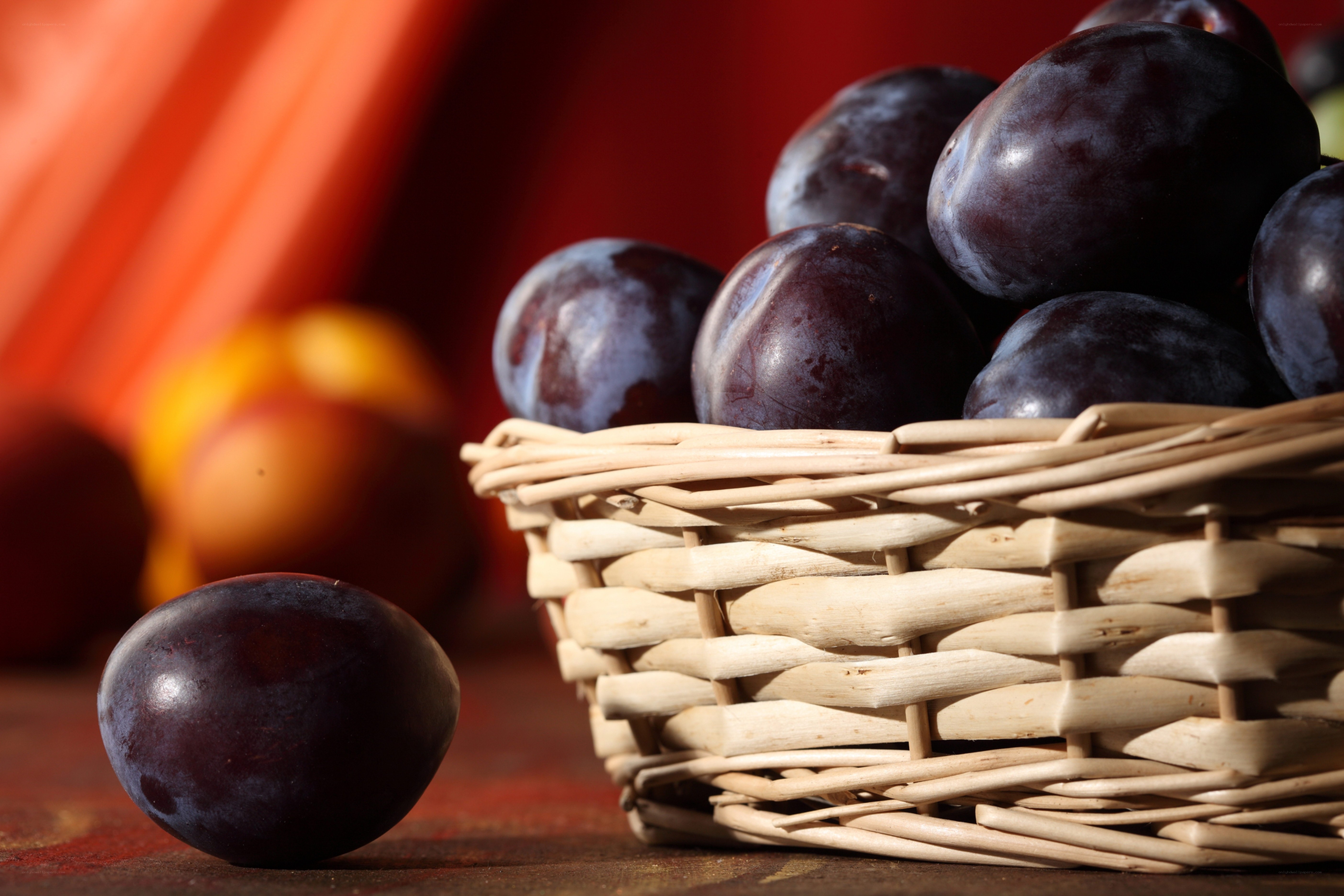 Plums in a wicker basket