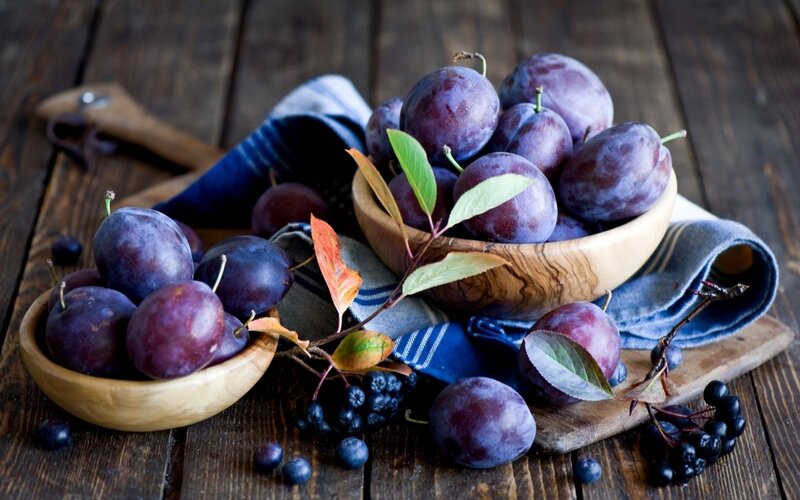 Plums in Wooden Bowls