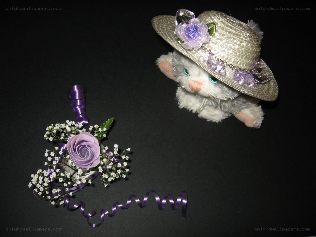 plush cat with hat and corsage