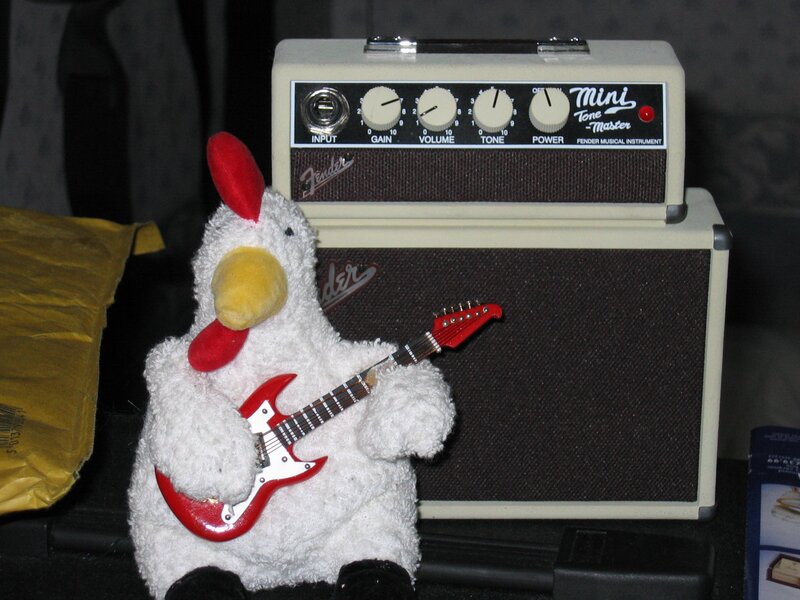 plush chicken with guitar