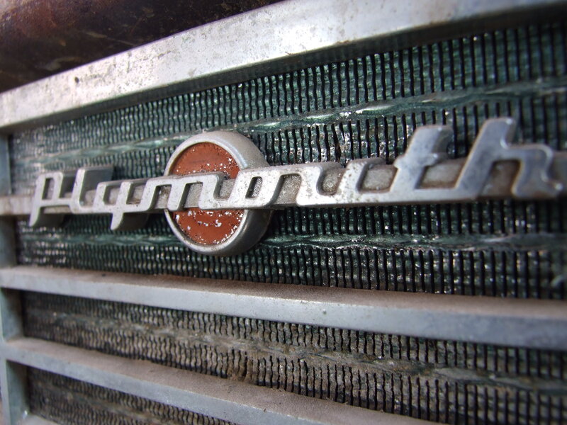 Plymouth car emblem on grille
