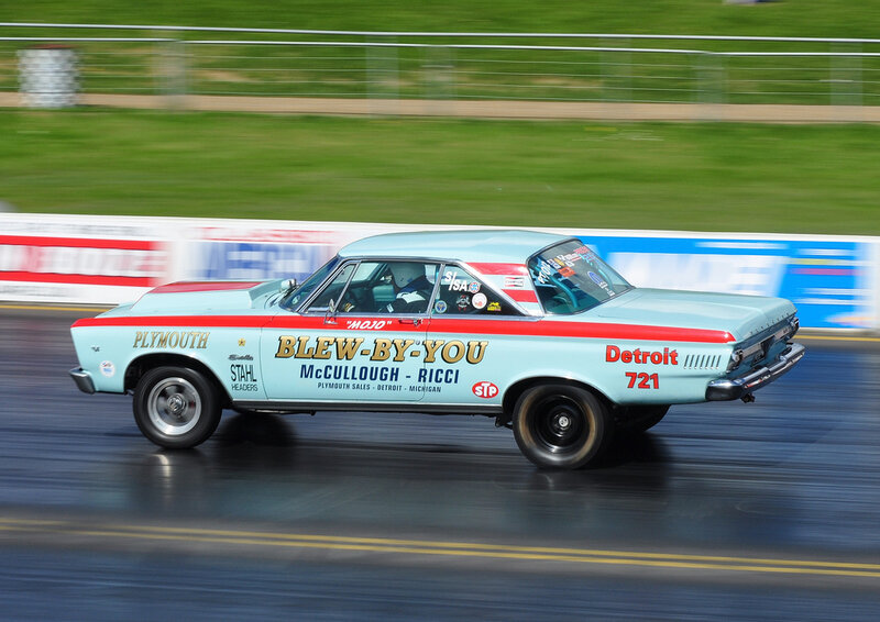 Plymouth drag racing car in motion
