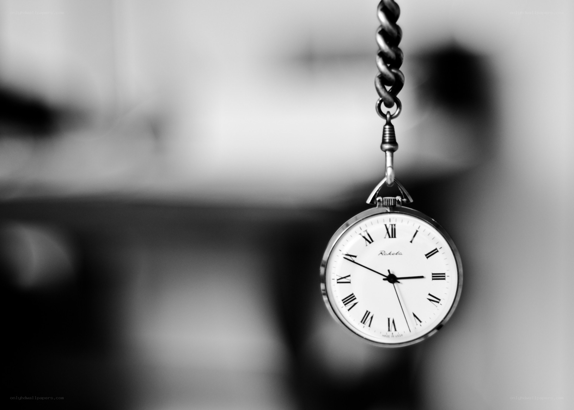 Pocket watch hanging on chain