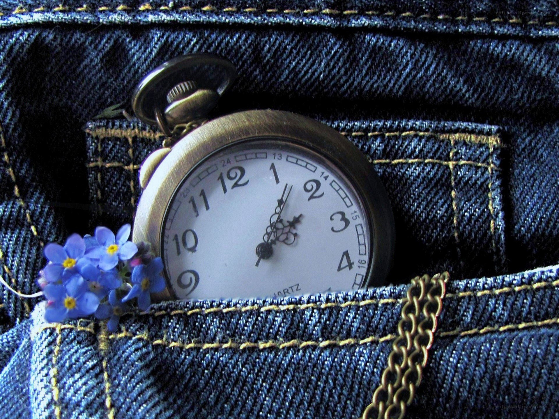 Pocket watch in jeans pocket