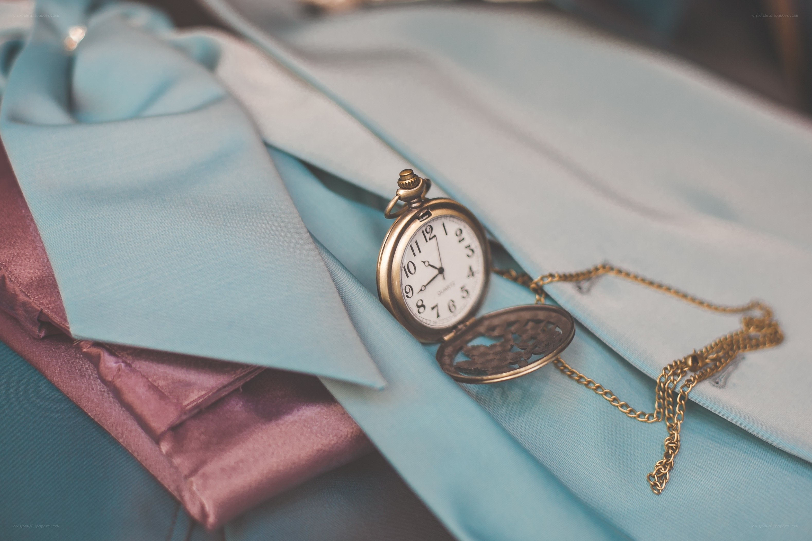 Pocket watch on blue fabric