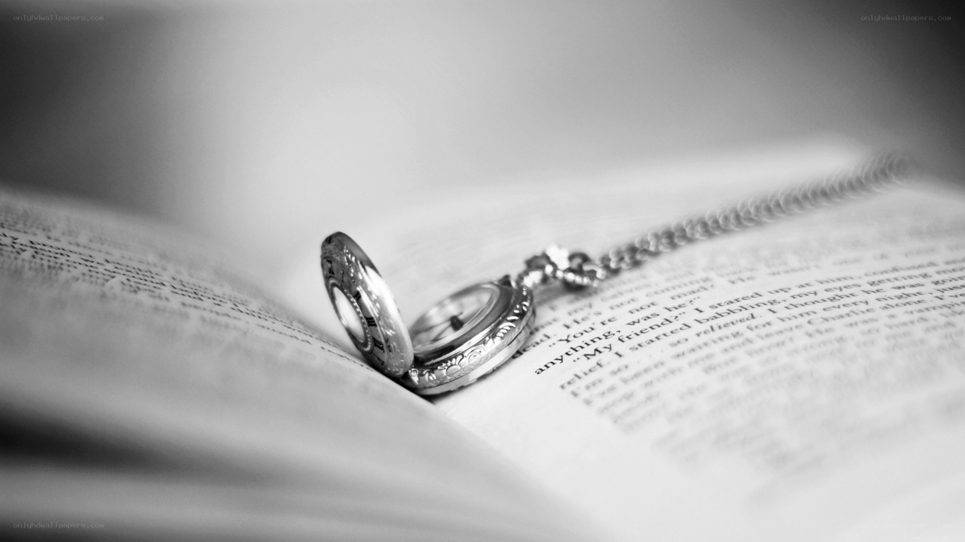 Pocket watch on open book