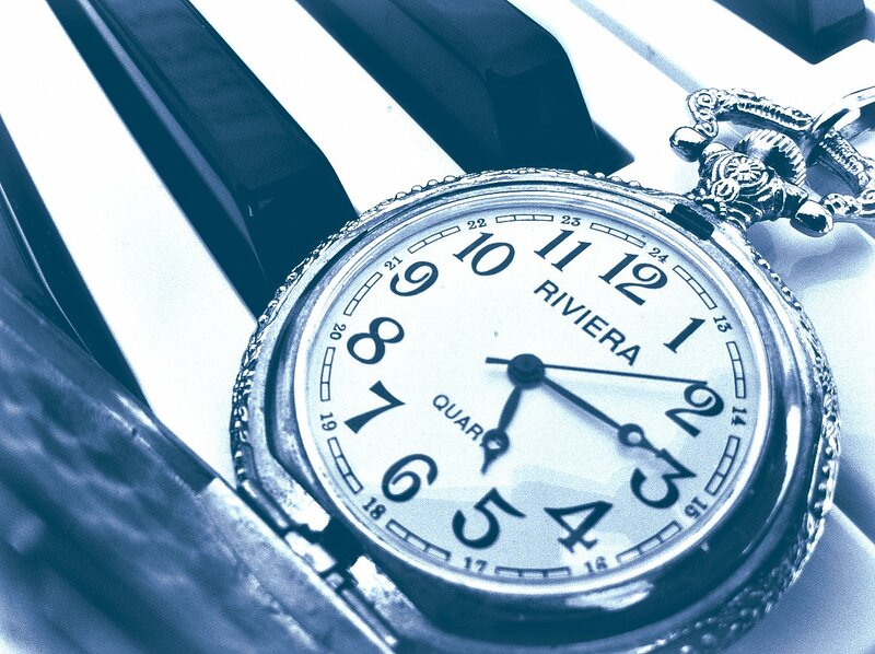 Pocket Watch on Piano Keys
