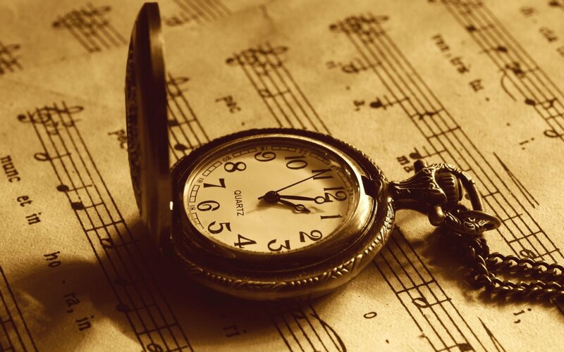 Pocket Watch on Sheet Music — Sepia