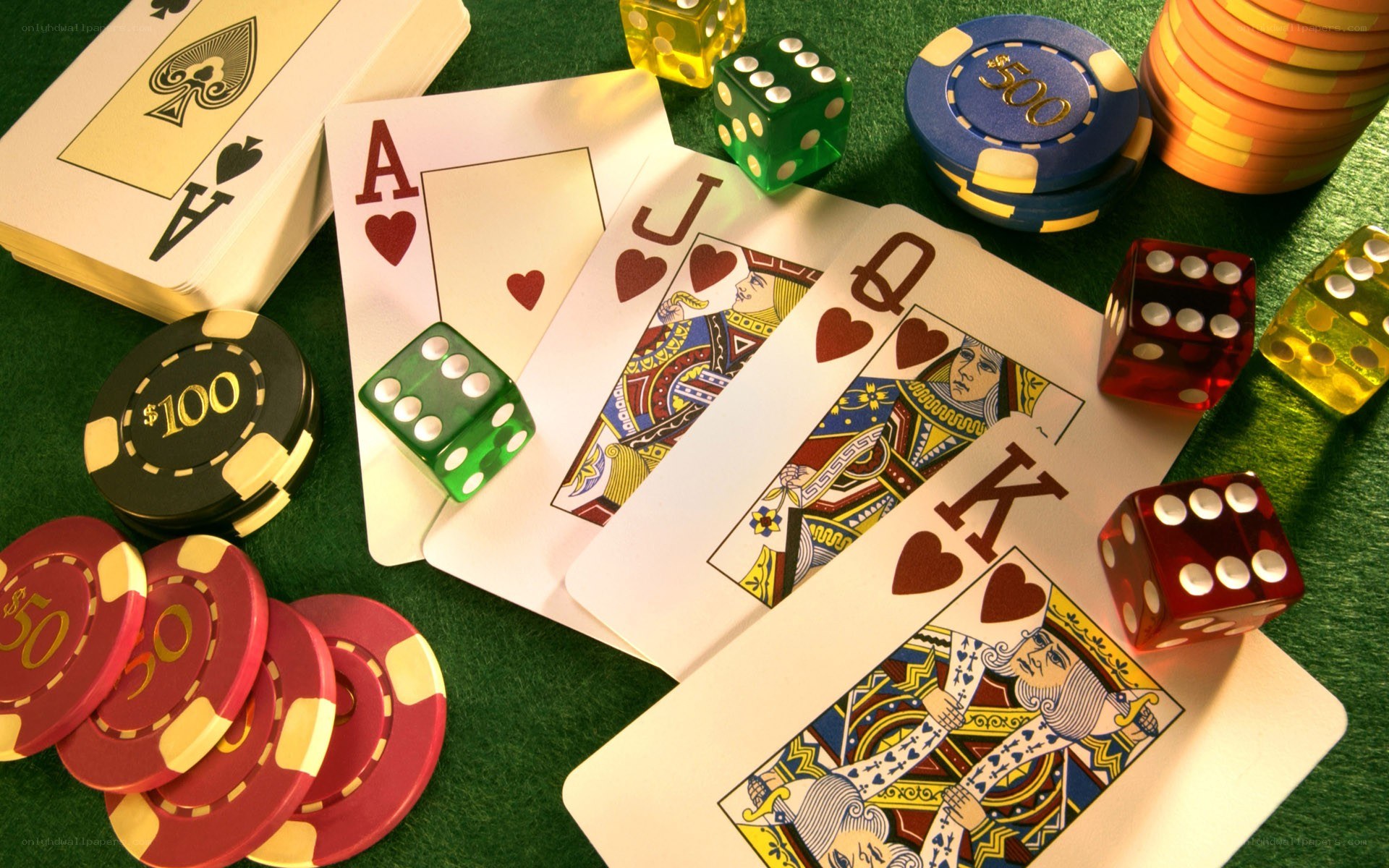 Poker cards and chips on green table