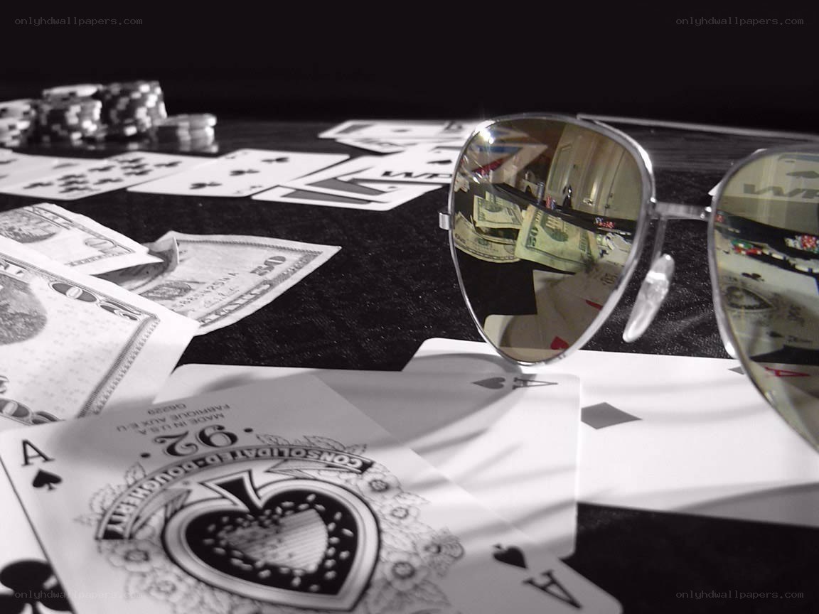 Poker cards and money on table