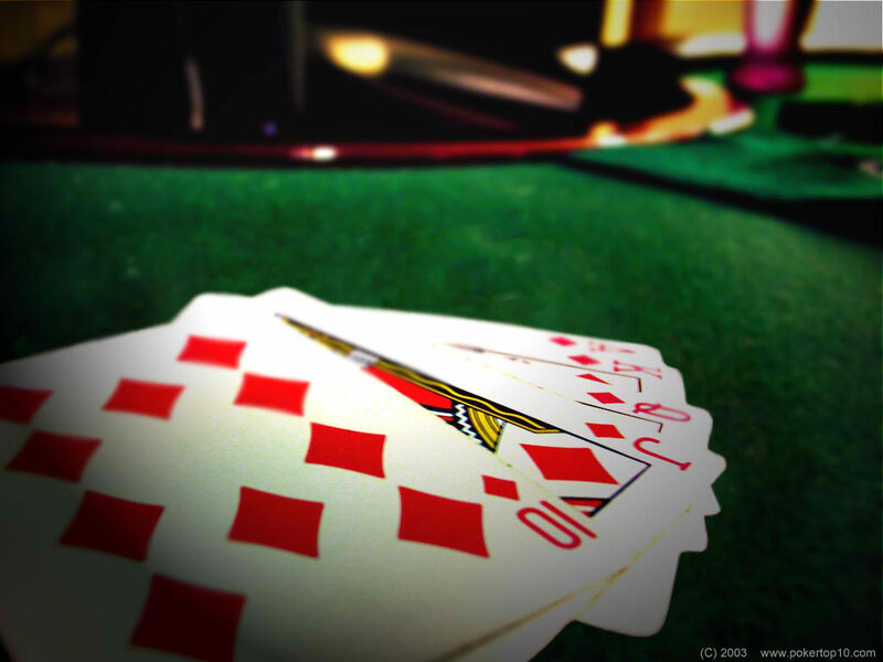 Poker cards on green felt