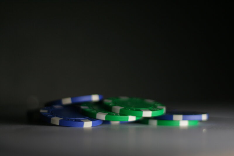 poker chips on dark surface