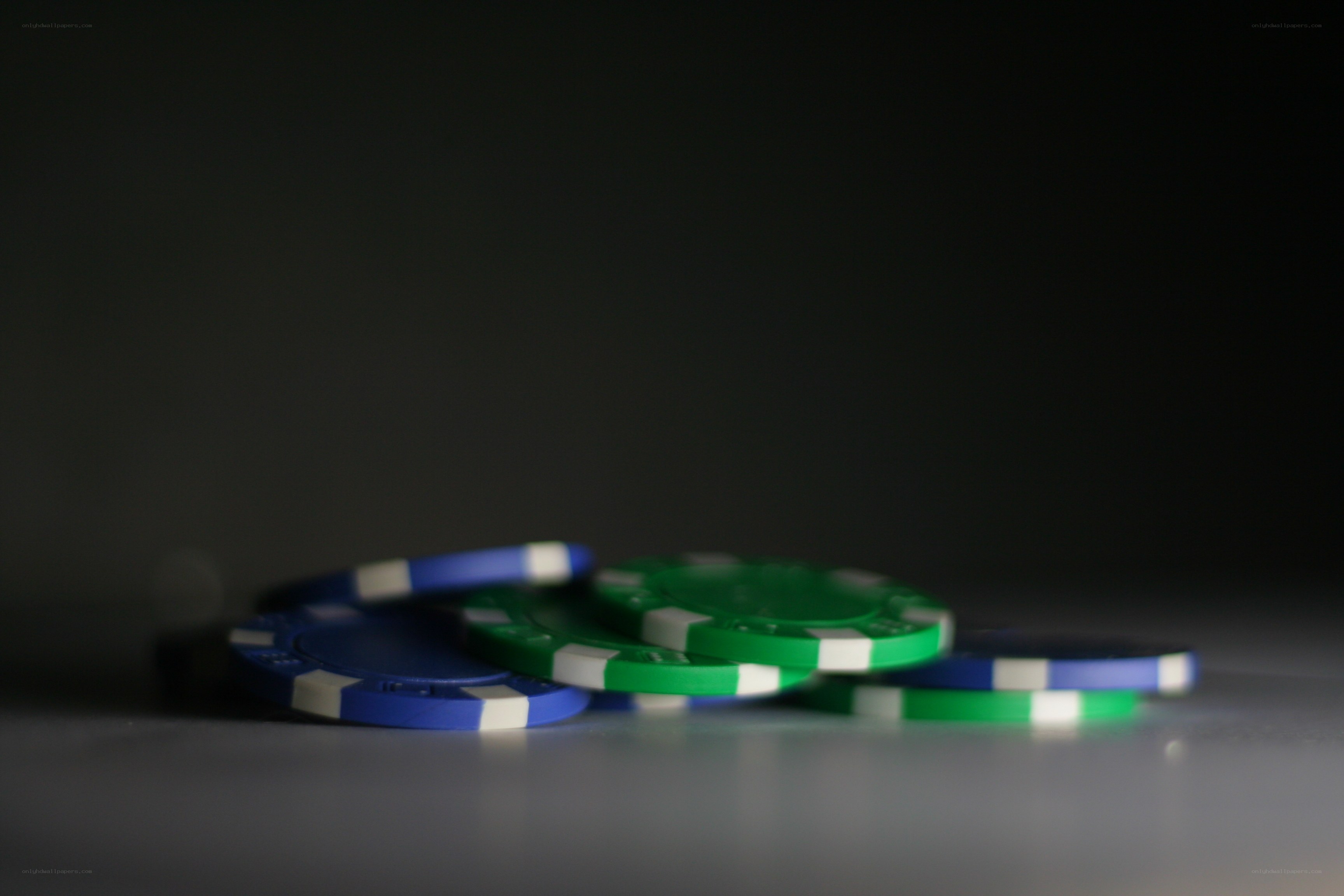 poker chips on dark surface