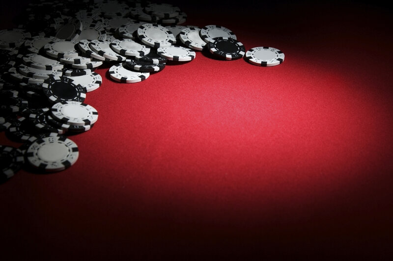 Poker chips on red table