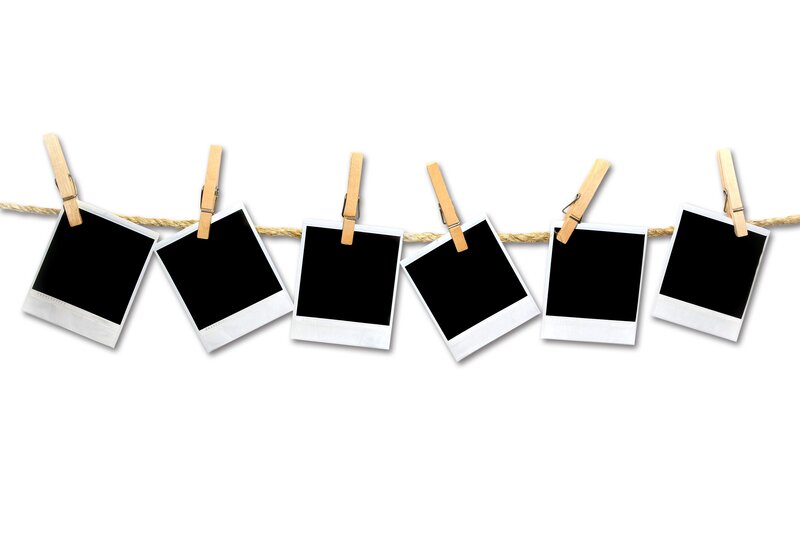 Polaroid photos on a clothesline