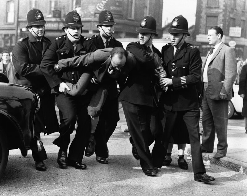 Police arrest a man on the street