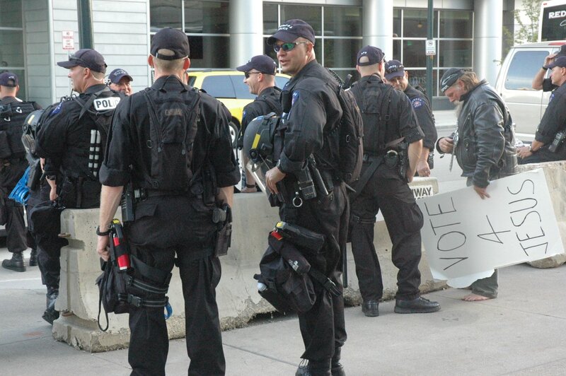 Police at protest with sign