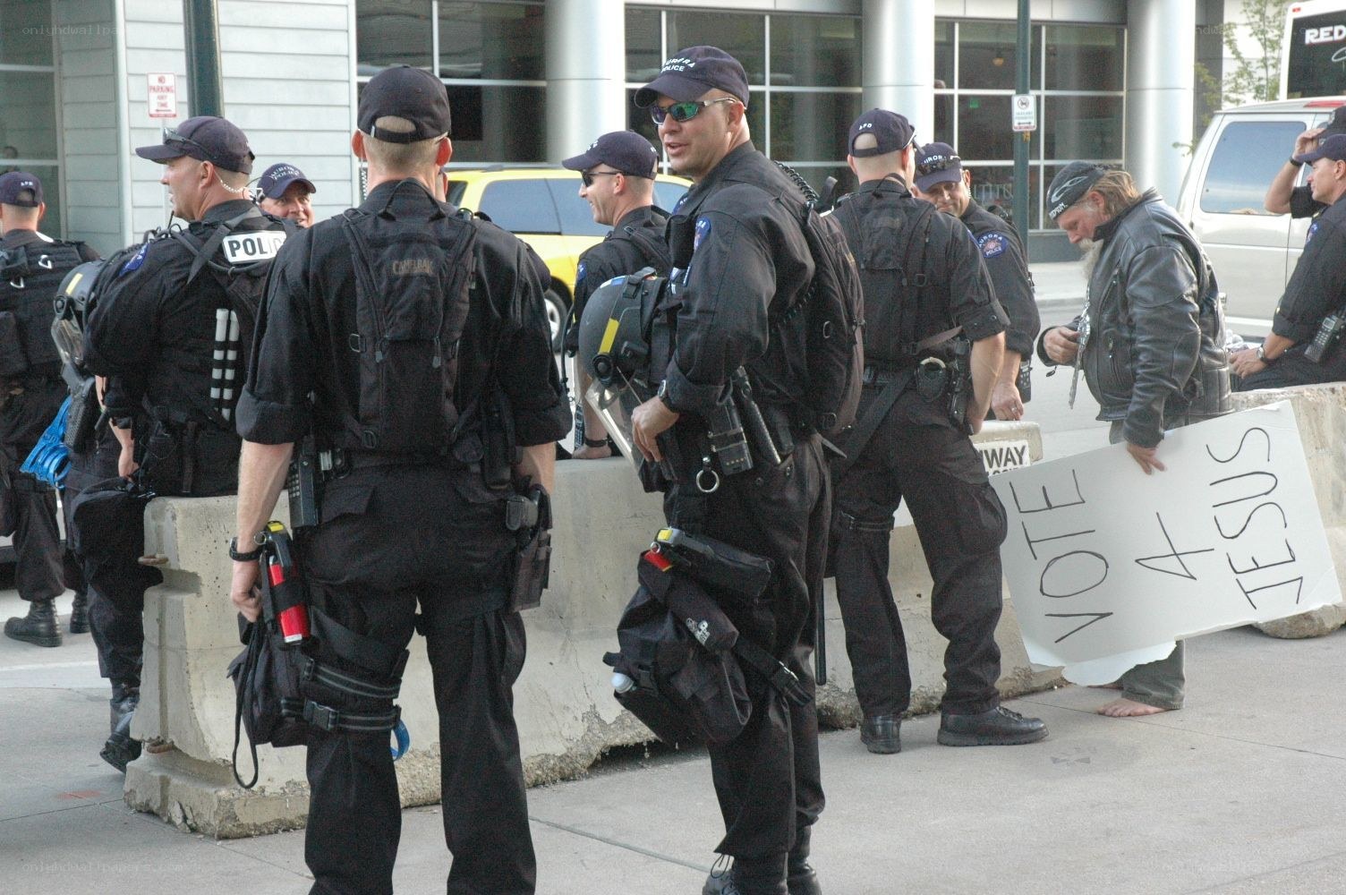 Police at protest with sign