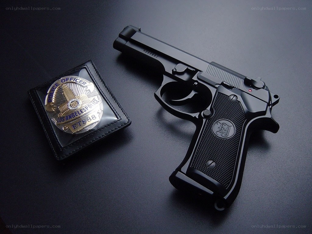 Police badge and handgun