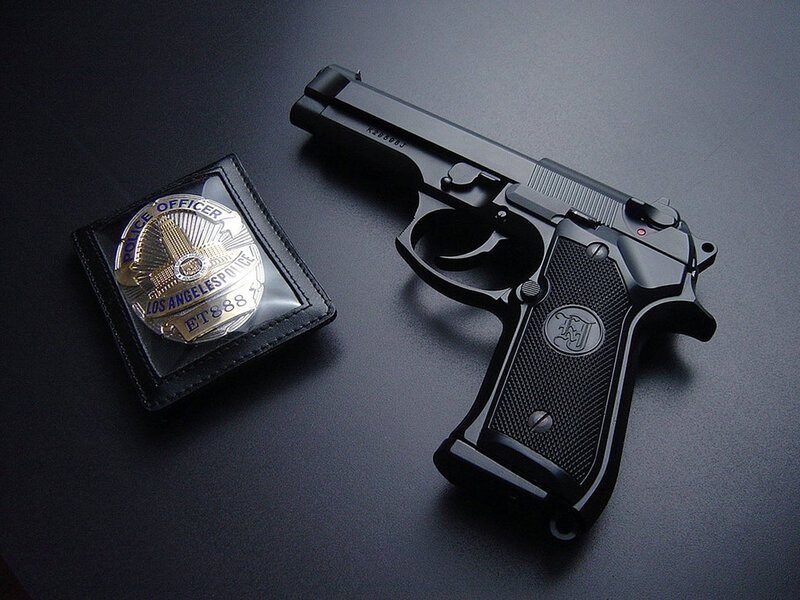 Police badge and handgun