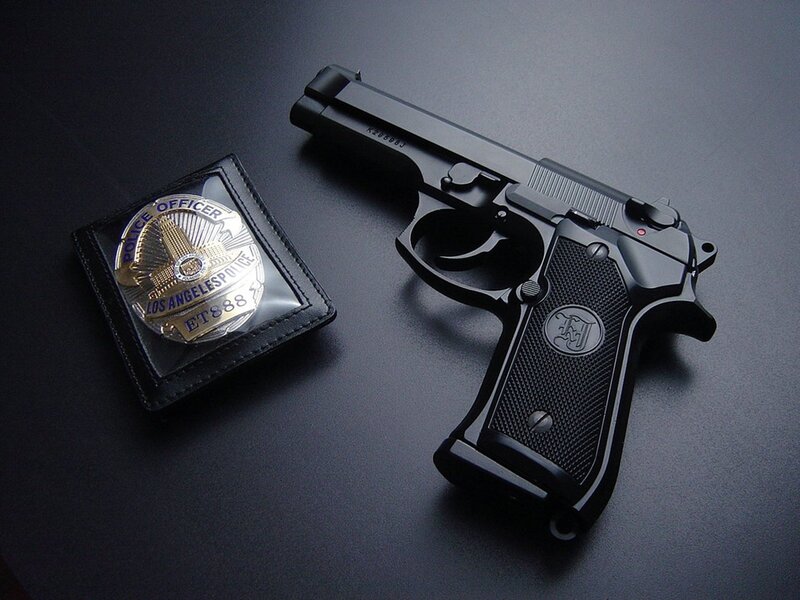 Police badge and handgun