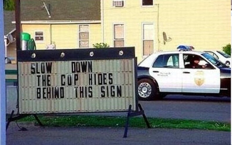 Police Car and Sign