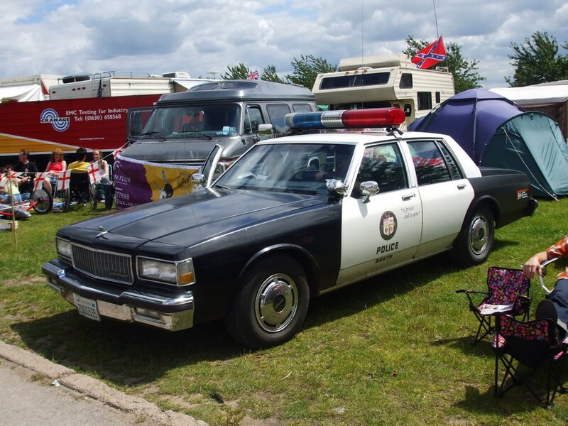 Police Car at Outdoor Event — Black