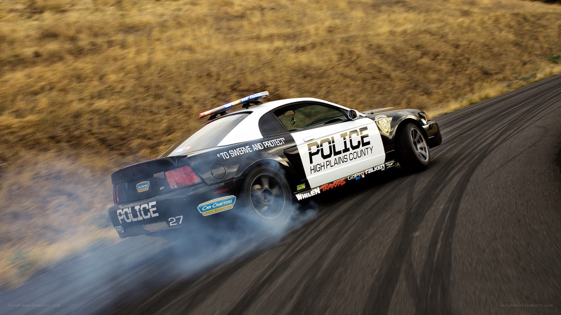 police car drifting on road