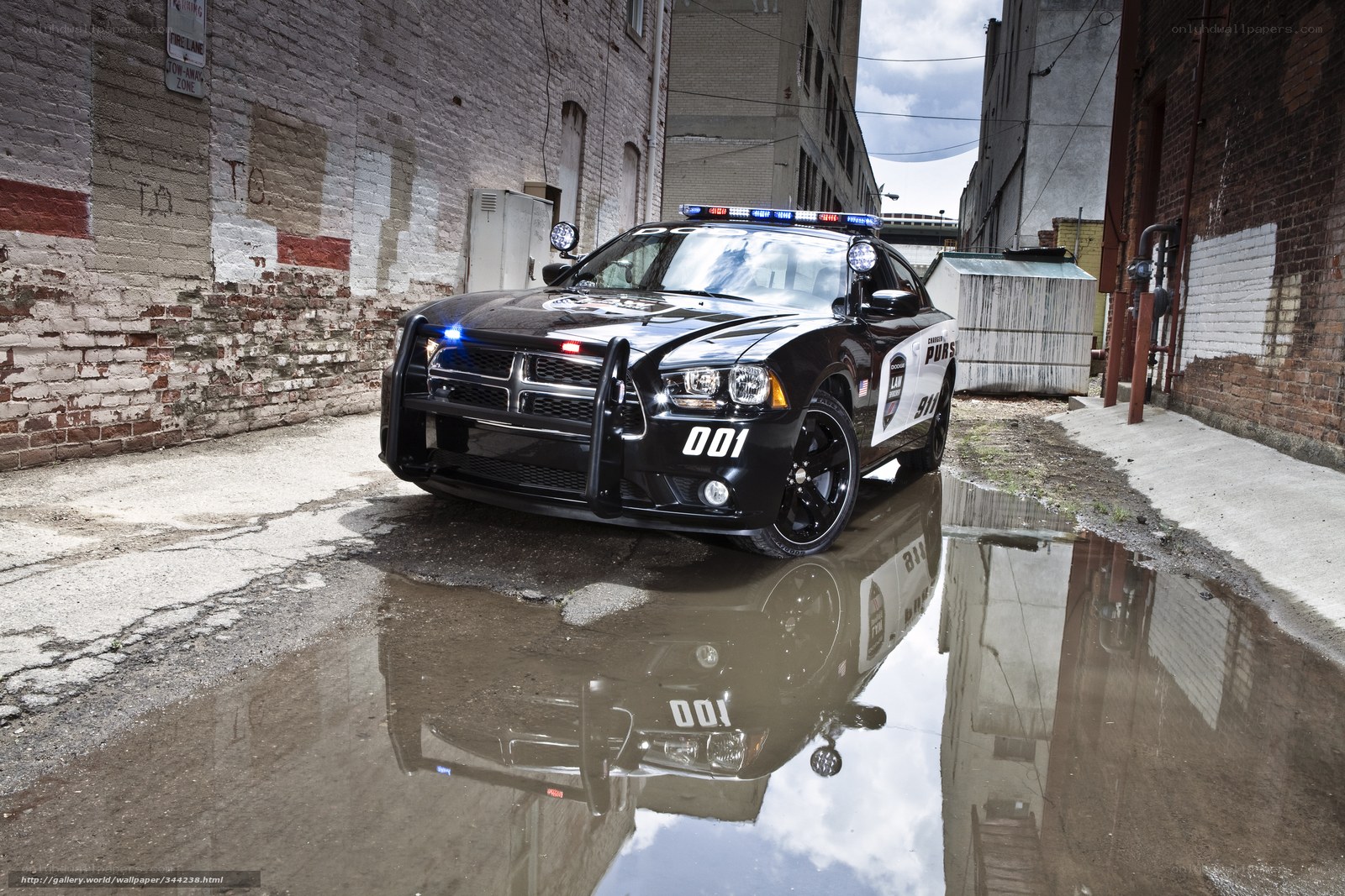 Police car in alleyway