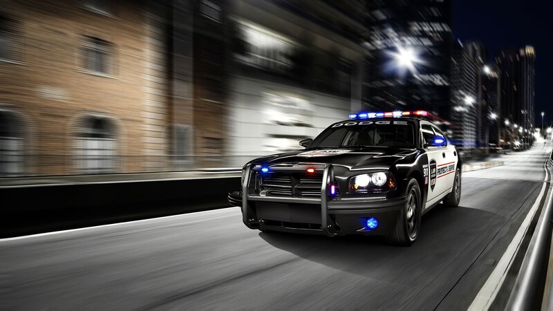 Police car in city at night