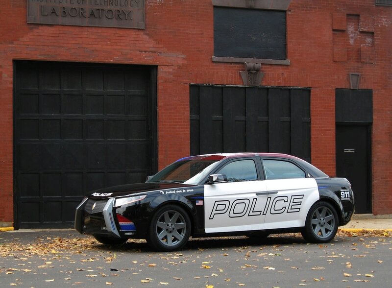 Police car in front of brick building