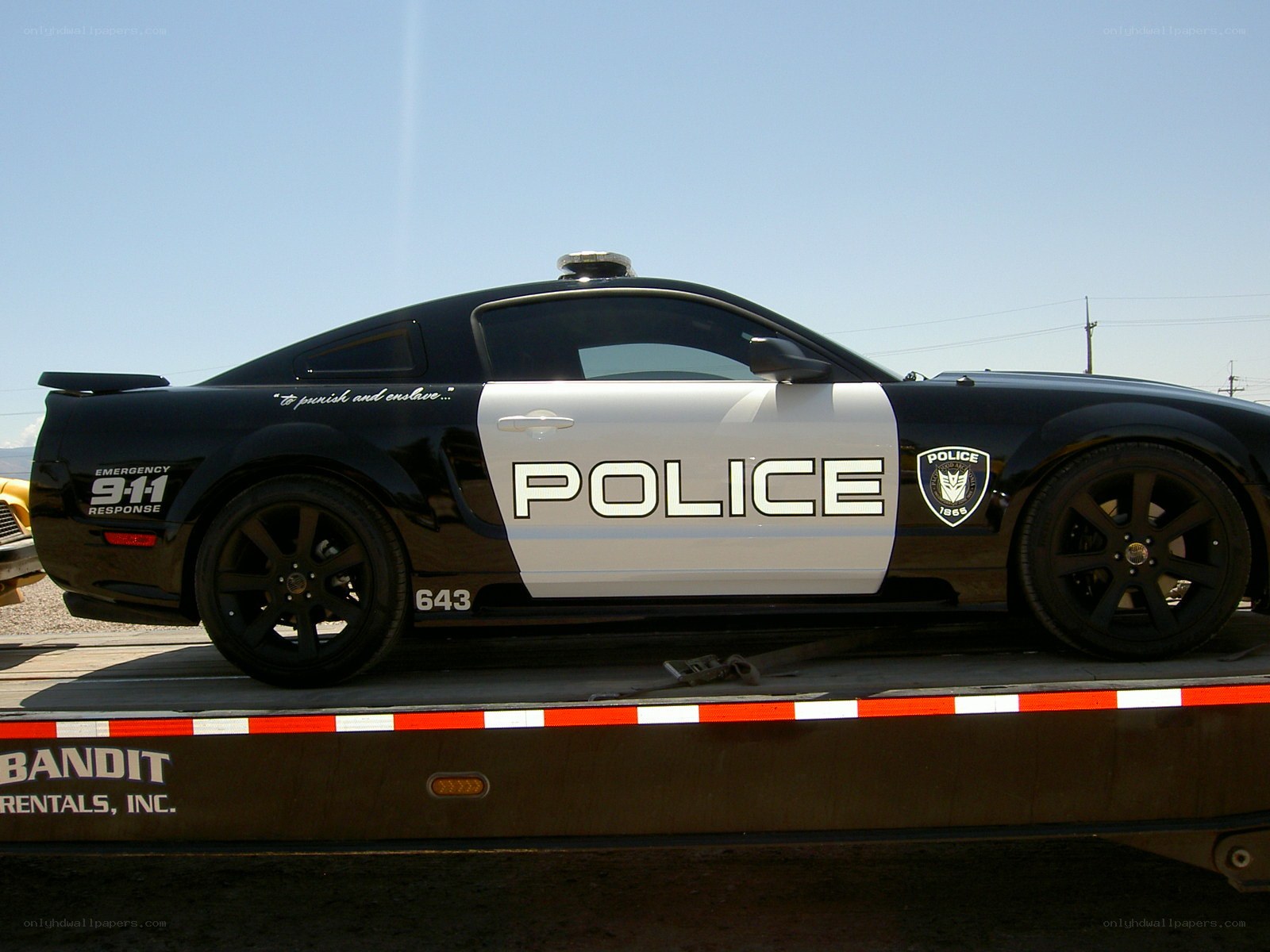 police car on flatbed trailer