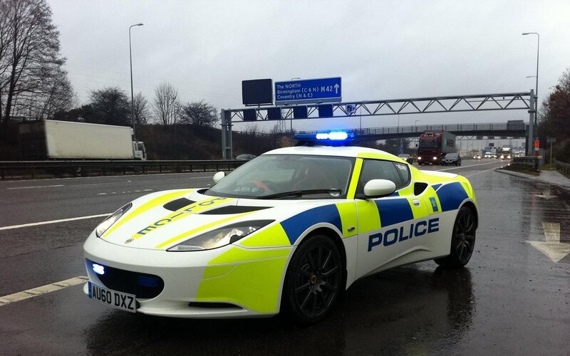 Police Car on Highway — White, Overcast