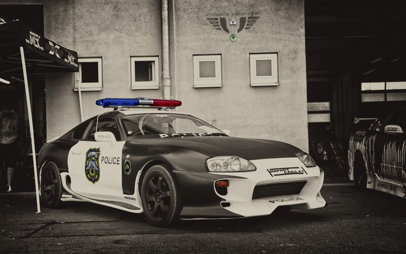 Police Car on Street — Black, Dramatic, Photograph