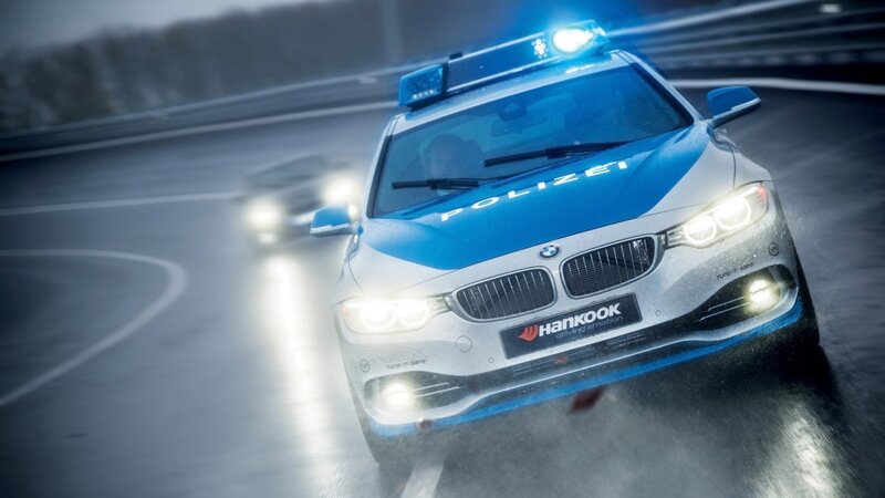 Police Car on Wet Road — Blue