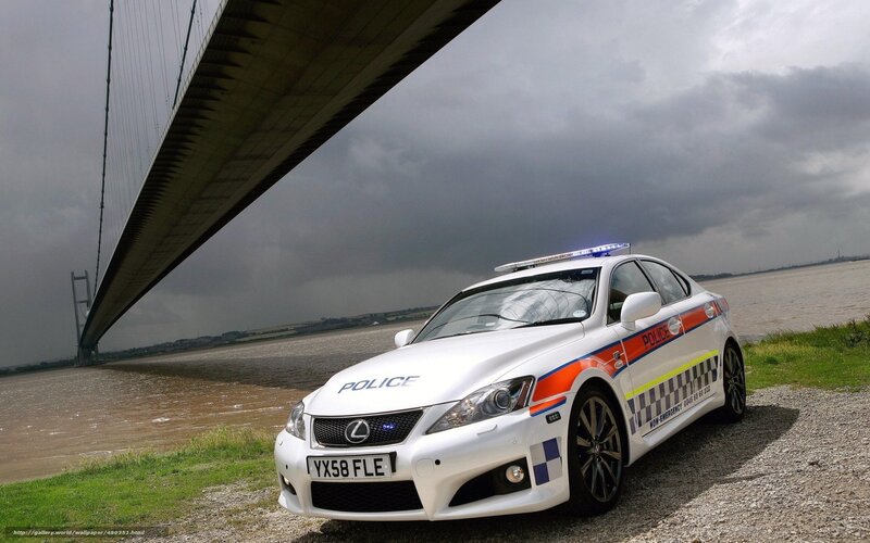 Police car under a bridge