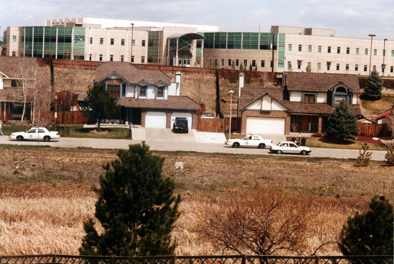 Police cars near suburban homes