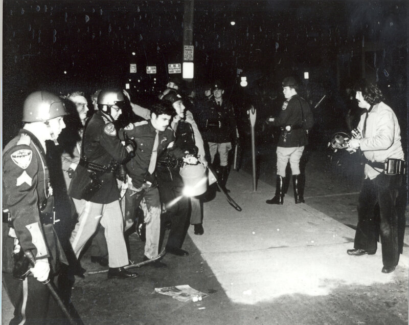 Police confront protesters at night