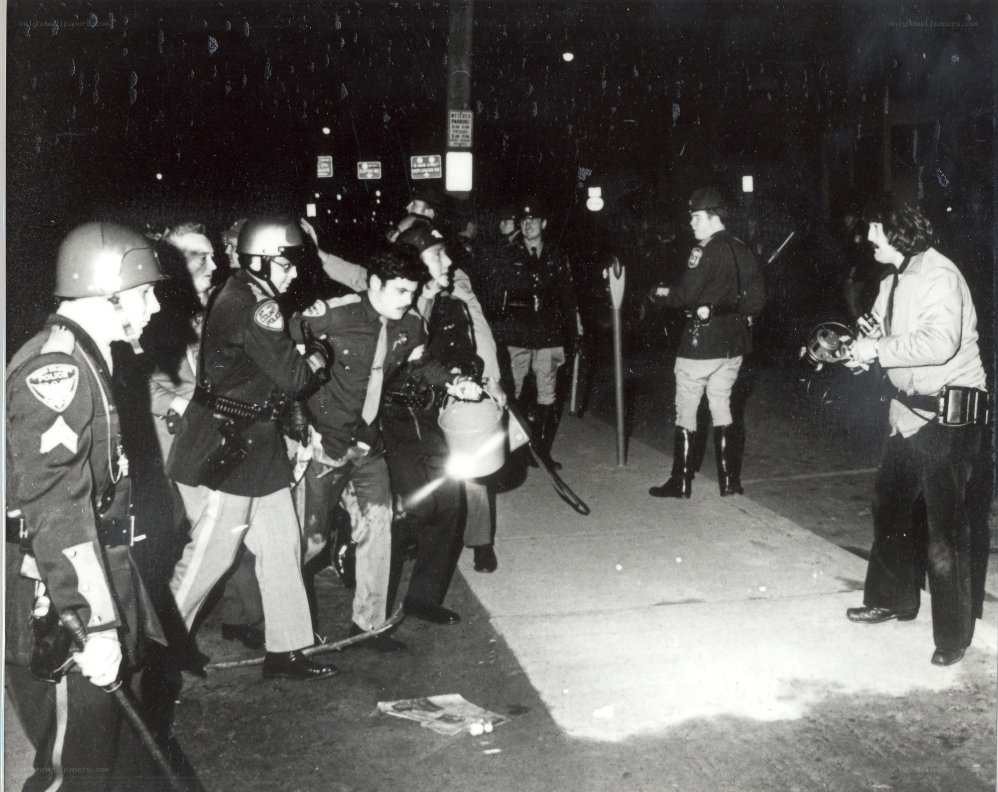 Police confront protesters at night