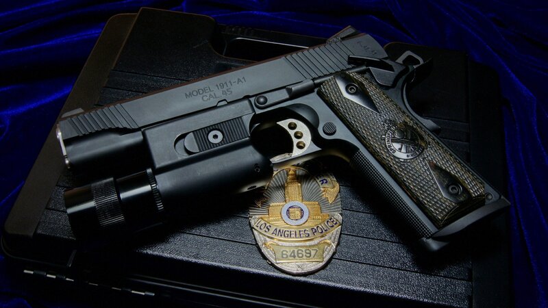 Police Handgun and Badge