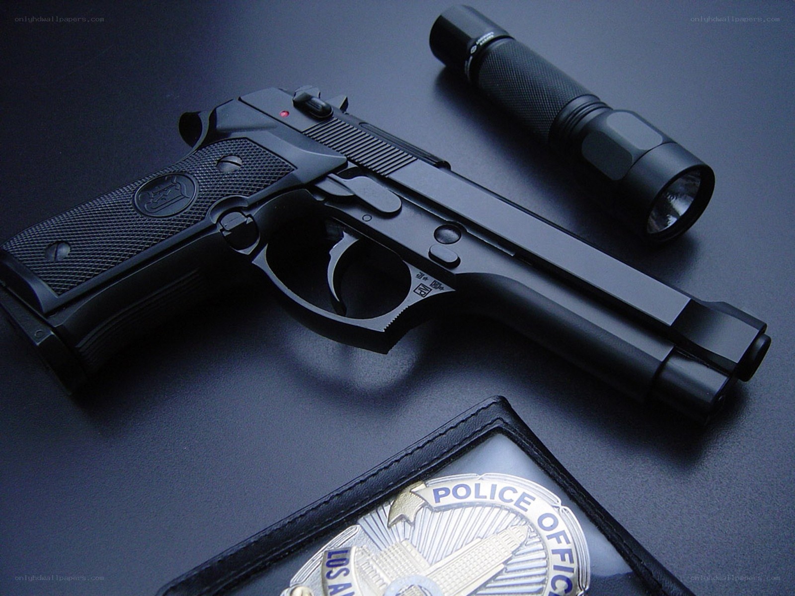 Police handgun and flashlight