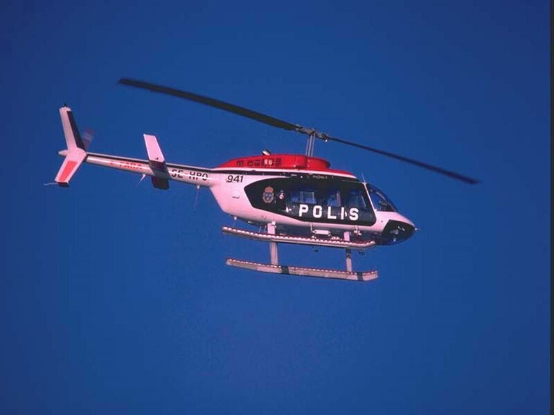 Police Helicopter in Flight — Blue