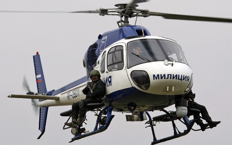 Police helicopter with officers